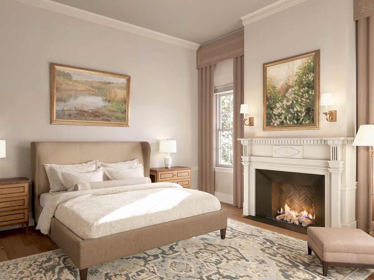 A cozy bedroom with a bed, fireplace, artwork, and windows; warm lighting creates an inviting atmosphere.